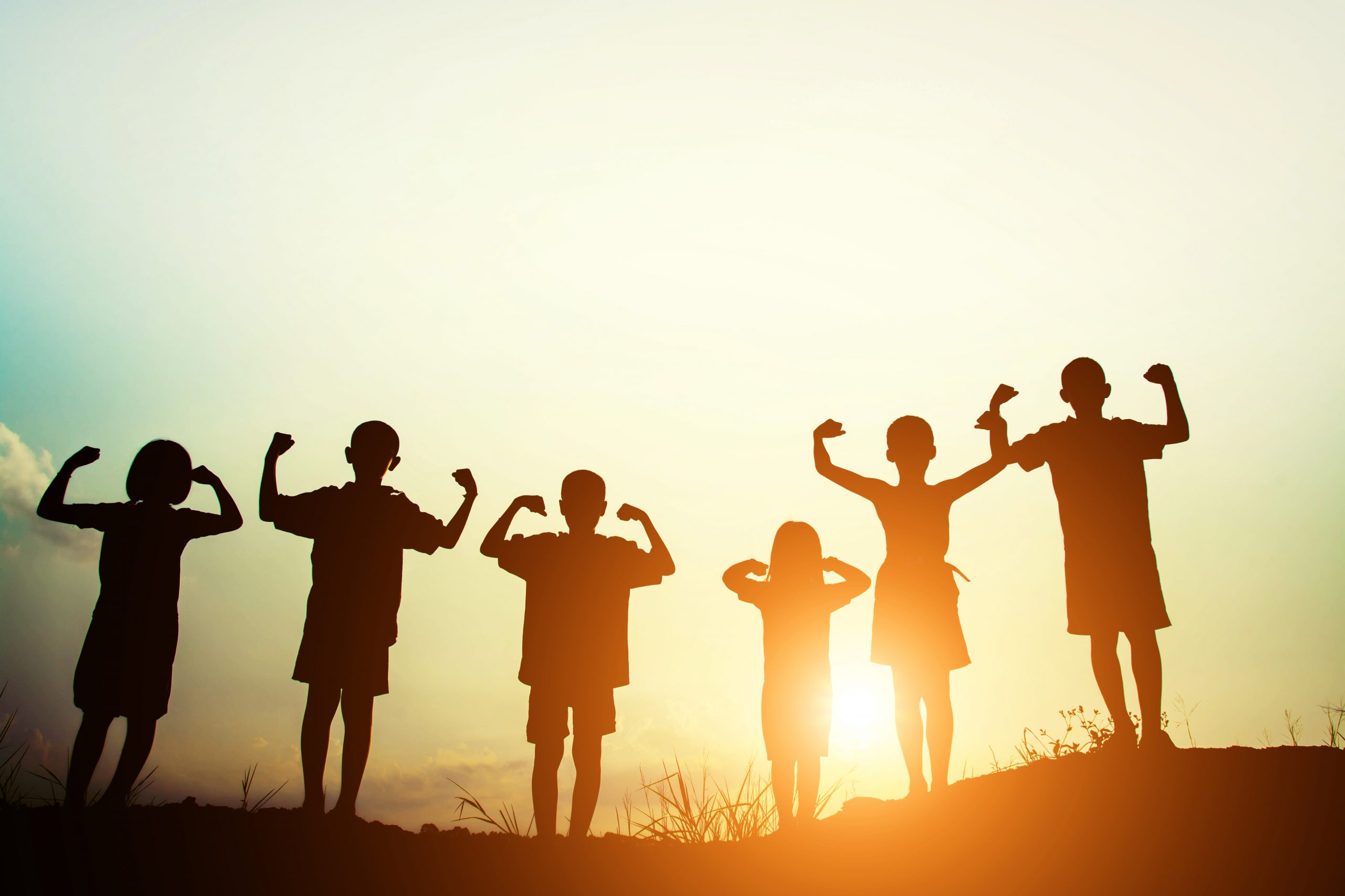 children s silhouettes showing muscles sunset scaled